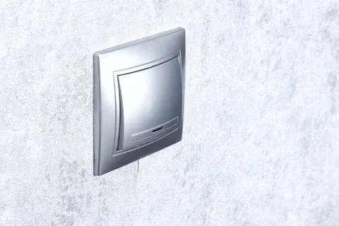 Silver switch, turn on or turn off the lights . Stock Photos