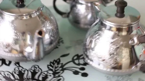 Silver teapots on the rotating tray 스톡 동영상 71983231