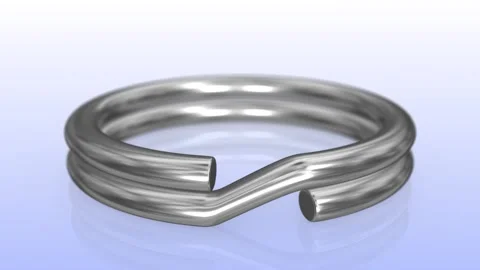 Silver Textured 3D Key Ring on a Reflective Floor. Camera Focus on Ring. 4K Video stock 283089252