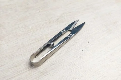 Silver Thread Scissors on White Table Stock Photos
