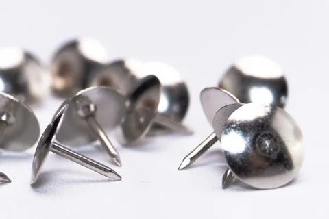 Silver Thumbtacks on White Background, Close-Up of Metal Push Pins, Office .. Stock Photos