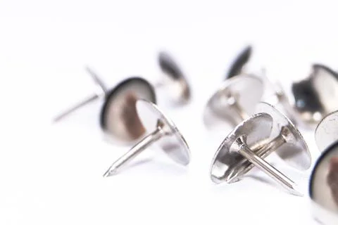 Silver Thumbtacks on White Background - Close-Up of Metal Push Pins for Off.. Stock Photos