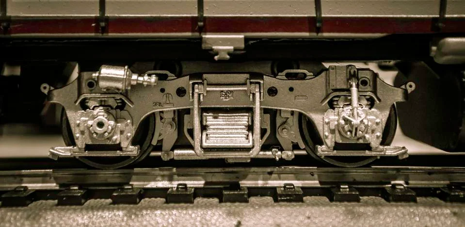 Silver train wheels on train track Stock Photos