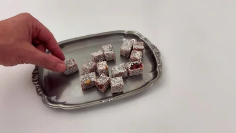 Silver tray of Turkish delight cubes dusted with powdered sugar 스톡 동영상 323259889
