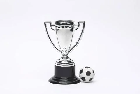 Silver trophy cup with black base and small soccer ball Stock Photos