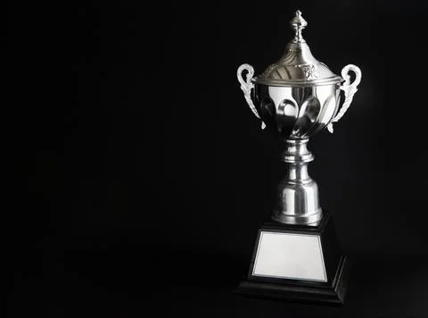 Silver trophy over black background. Winning awards with copy space for tex.. Foto stock