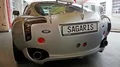 Silver TVR Sagaris exhibition automobile rear view in showroom 4k 4k or 4k+ Resolution