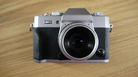 Silver vintage camera with modern features Stock Illustration