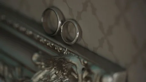 Silver Wedding Rings on the bed macro closeup shoot diamon Jewellery Stock-Footage 95047015