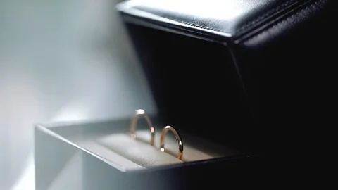 Silver Wedding Rings in the black box macro closeup shoot diamon Jewellery Stock Footage 114491182