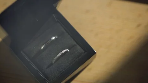 Silver Wedding Rings in the black box macro closeup shoot diamon Jewellery Stock Footage 114491402