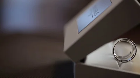 Silver Wedding Rings in the box macro closeup shoot diamon Jewellery Stock Footage 93716698