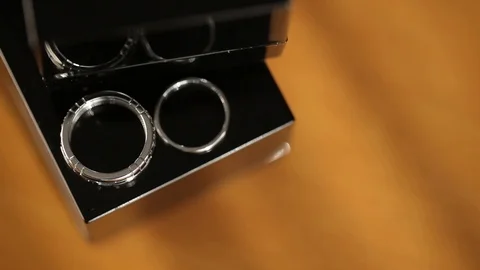 Silver Wedding Rings in the box macro closeup shoot diamon Jewellery 動画素材 93716948