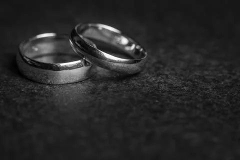 Silver Wedding Rings on a rock background Stock Photos