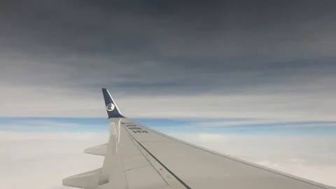 Silver wings flying in the white clouds Stock-Footage 146309198