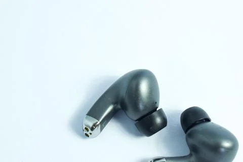 Silver wireless headset or earphone is called TWS 스톡 사진