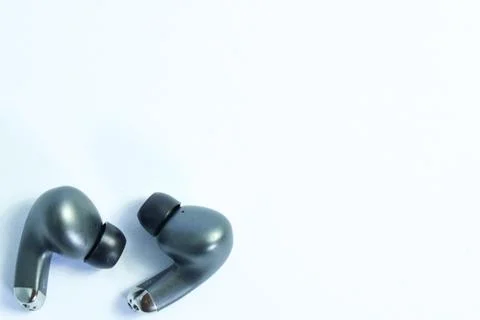 Silver wireless headset or earphone is called TWS 스톡 사진