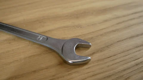 Silver wrench on the table Stockbeeldmateriaal 130242999