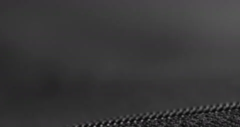 Silver zipper on a carbon like material Stock Footage 128493869