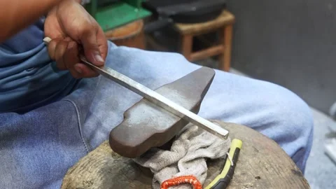 Silversmith beating silver bar with hammer Stock Footage 194605829