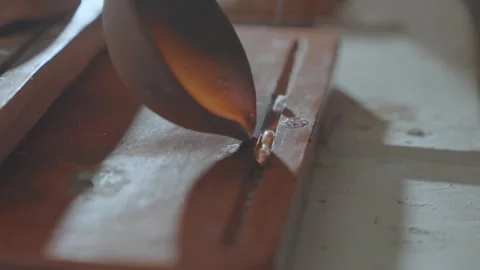 Silversmith Casting Hot Liquid Silver for Jewelry Production 動画素材 333732899