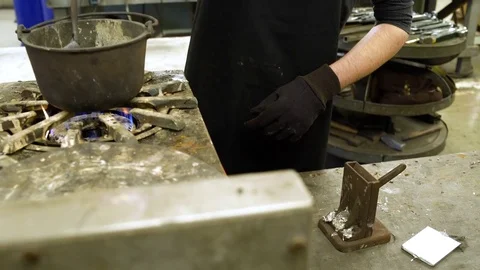 Silversmith casting in a workshop Stock Footage 83399794