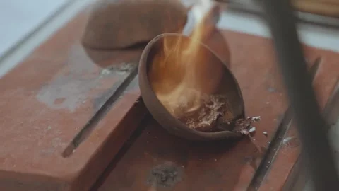 Silversmith Heating Silver on Clay with Intense Fire Flame in Jewelry Workshop Video stock 333733233