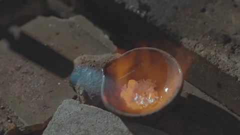 Silversmith Melting Raw Silver Pieces for Jewelry Casting in Workshop 動画素材 333734301