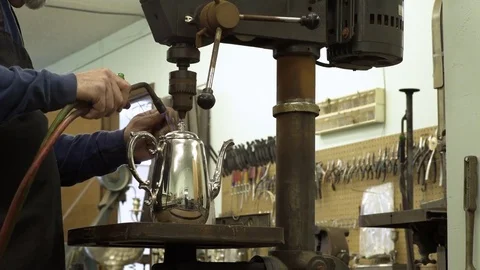 Silversmith working on a teapot 動画素材 83399649