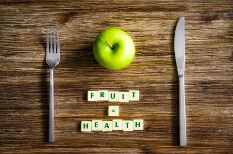 Silverware and apple set on table with healthy sign Foto stock