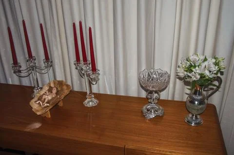 Silverware and doll representing the birth of Jesus Christ in São Paulo. Stock Photos