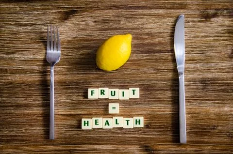 Silverware and lemon set on table with healthy sign Stock Photos