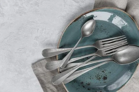 Silverware on a ceramic plate Stock Photos