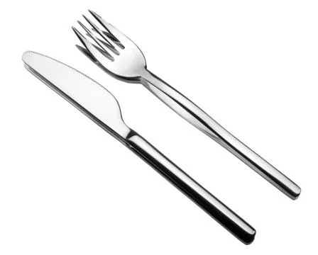 Silverware on a mirror. fork and knife. Stock Photos