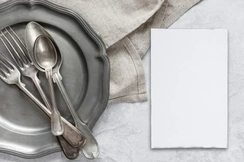 Silverware on a pewter plate Stock Photos