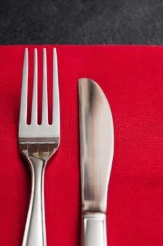 Silverware  on red napkin Stock Photos