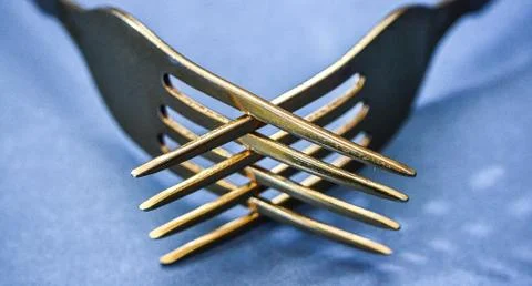 Silverware, two yellow forks, close-up Stock Photos