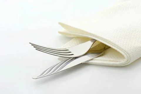 Silverware wrapped in cloth napkin Stock-Fotos