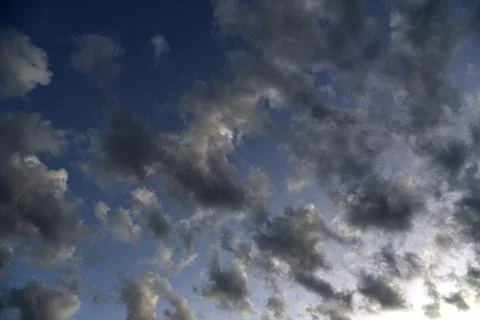 Silvery clouds in the blue sky in the evening. Beautiful blue clouds on a sum Foto stock