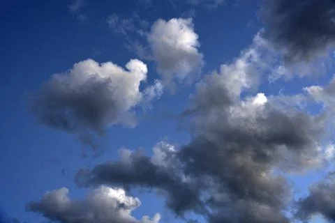 Silvery clouds in the blue sky in the evening. Beautiful blue clouds on a sum Foto stock