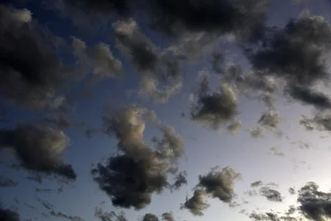 Silvery clouds in the blue sky in the evening. Beautiful blue clouds on a sum Foto stock