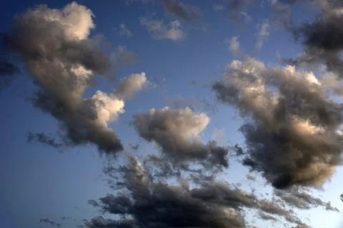 Silvery clouds in the blue sky in the evening. Beautiful blue clouds on a sum Foto stock