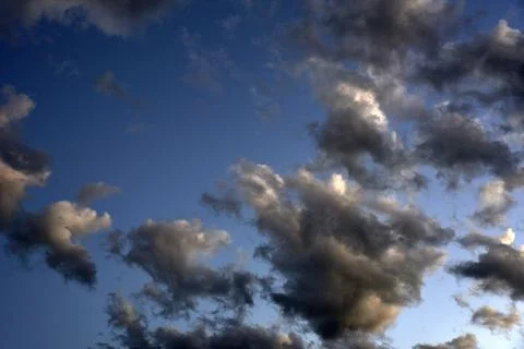 Silvery clouds in the blue sky in the evening. Beautiful blue clouds on a sum Foto stock