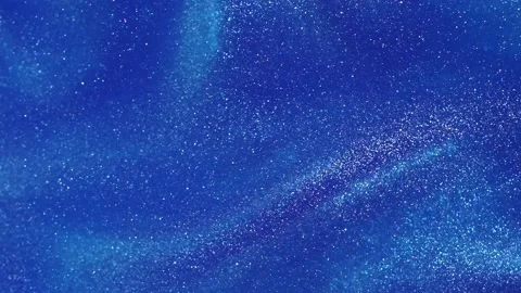 Silvery dust particles fly on a blue background. Video stock 237347090
