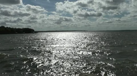 Silvery Lake with Dramatic Clouds Stock Footage 20503622