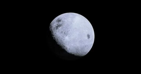 Silvery moon glowing brightly in the dark night sky over Earth Ilustração Stock