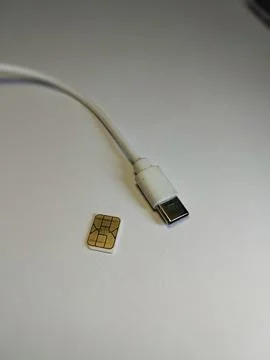 SIM Card and USB Adapter on White Background Stock Photos