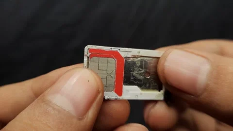 SIM Card Held by Hand in Macro Shot Stock Footage 310142905