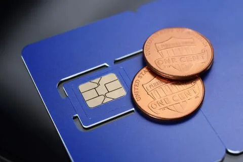 SIM card pre-cuted mini, micro, nano sizes and one cent coins. Stock Photos