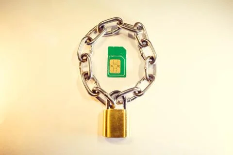 SIM card is protected by a lock with a chain 写真素材
